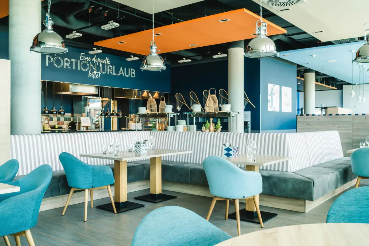 A restaurant with tables and chairs.