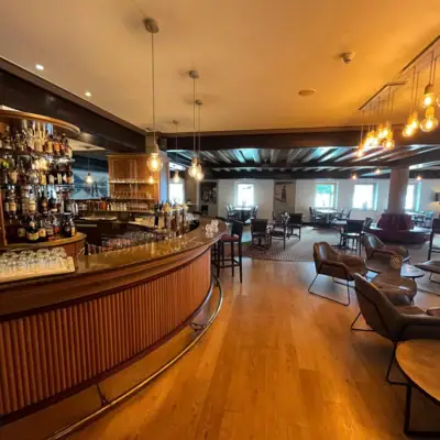 Bar A bar with counter and chairs.