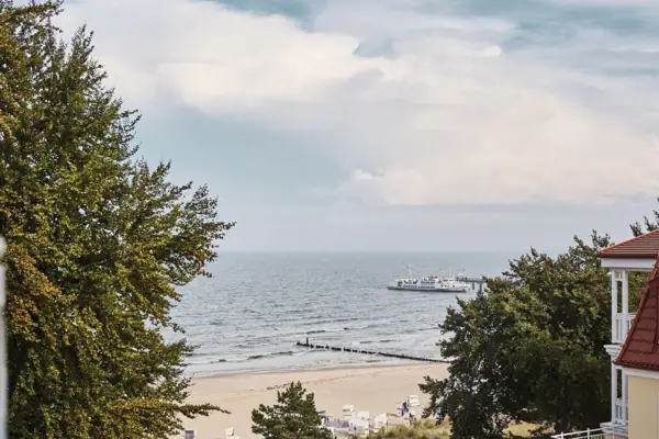 Outlook Boat on the water under a cloudy sky