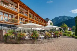 A building with a terrace and parasols.