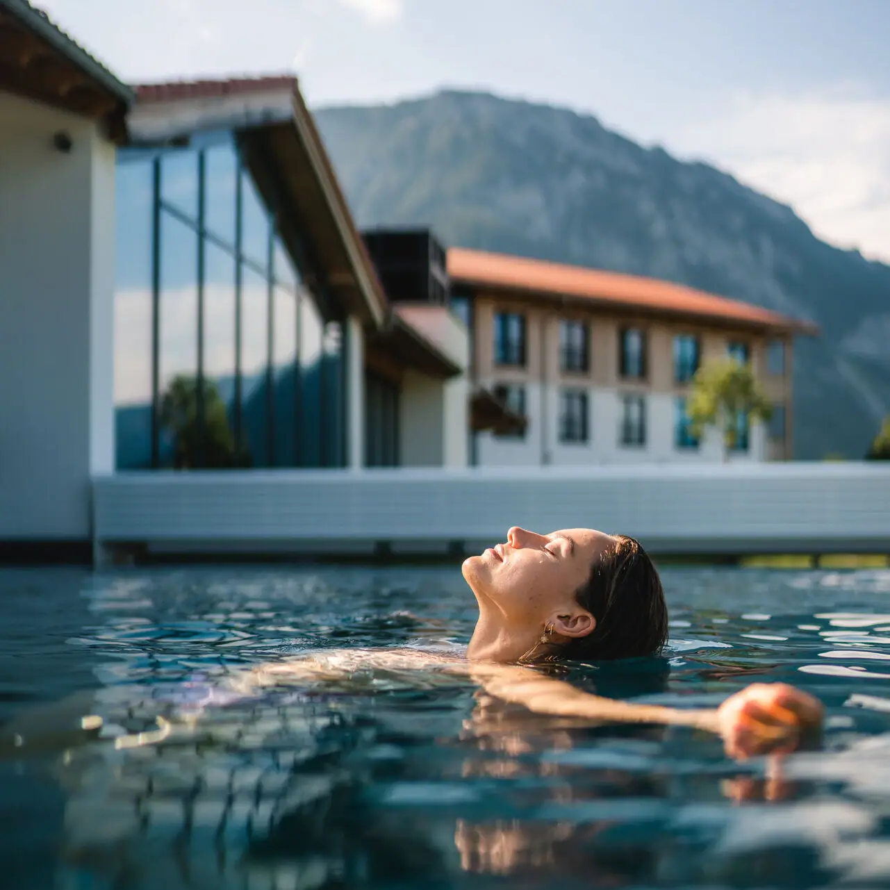A woman swims in a pool.