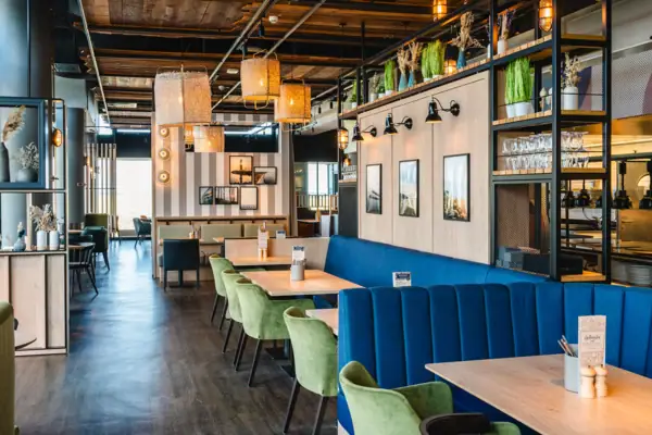 A restaurant with tables and chairs.