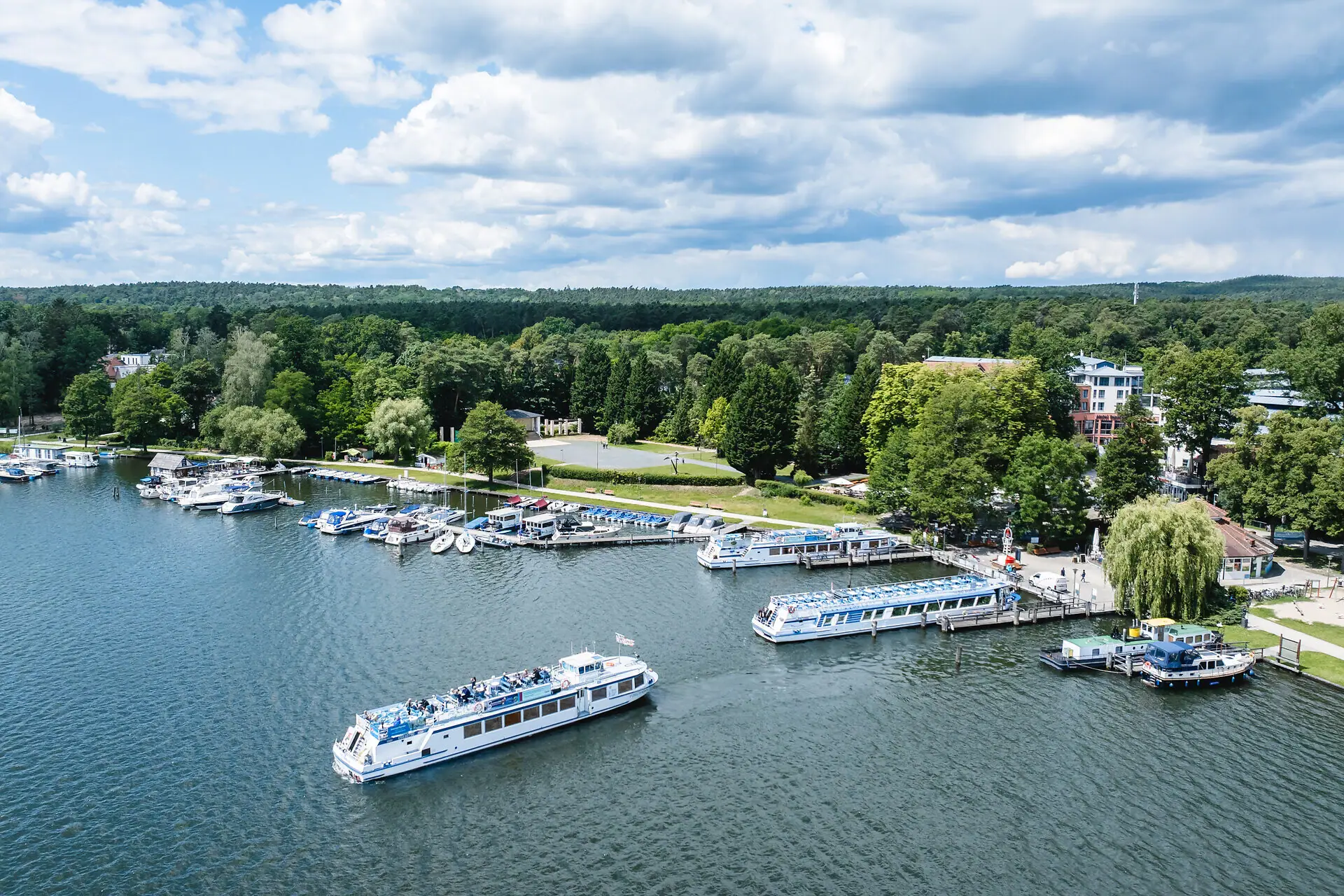 Boating Boats on the water with trees in the background