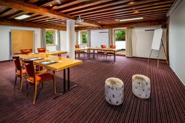 A room with tables and chairs.