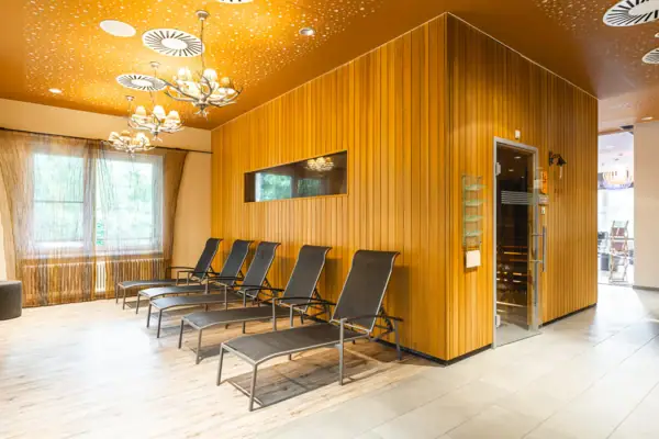 A room with chairs and a door.