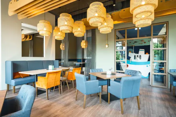 A room with a table and chairs.