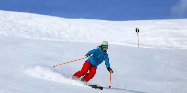 Person skiing on a snowy slope.