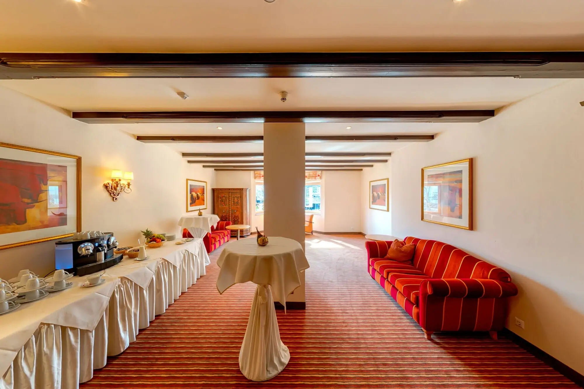 A room with tables and chairs.