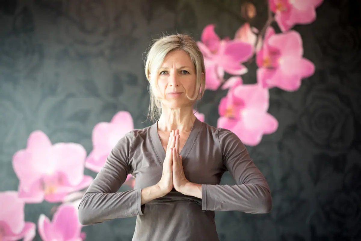 A woman does a yoga pose.