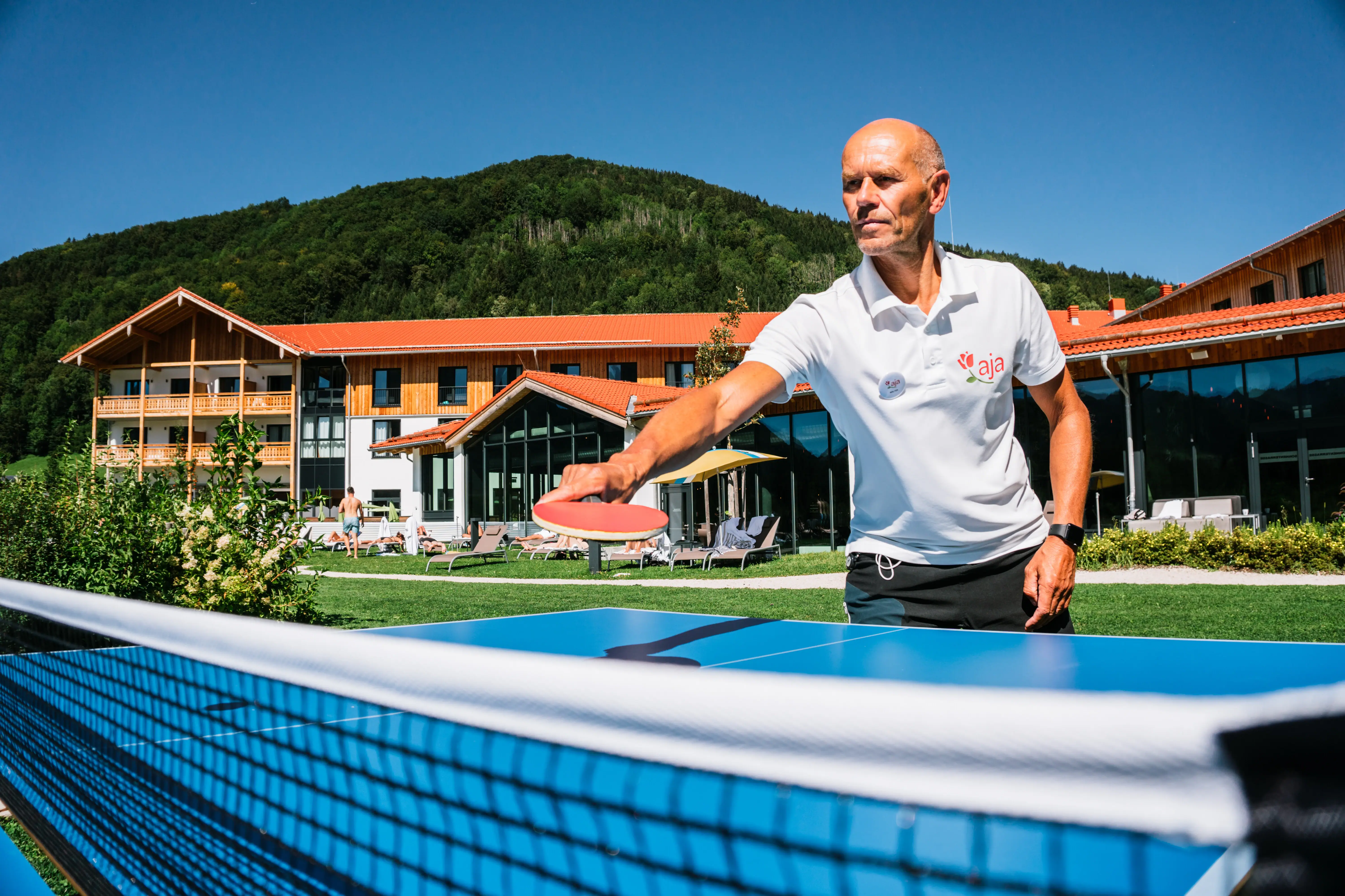 Table tennis A man holds a tennis racket.