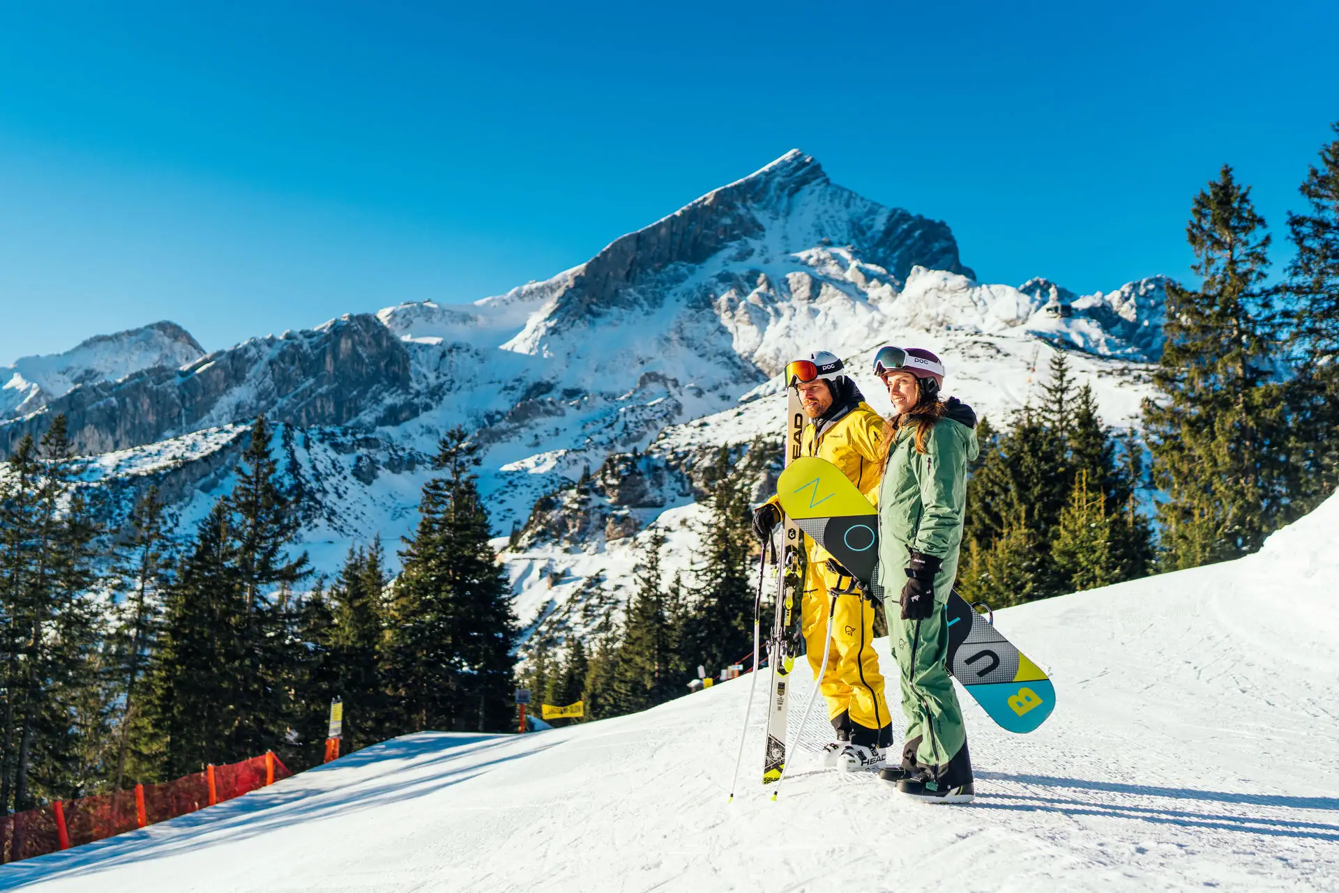 Ski holiday Two people in snow clothing on a snow-covered mountain.