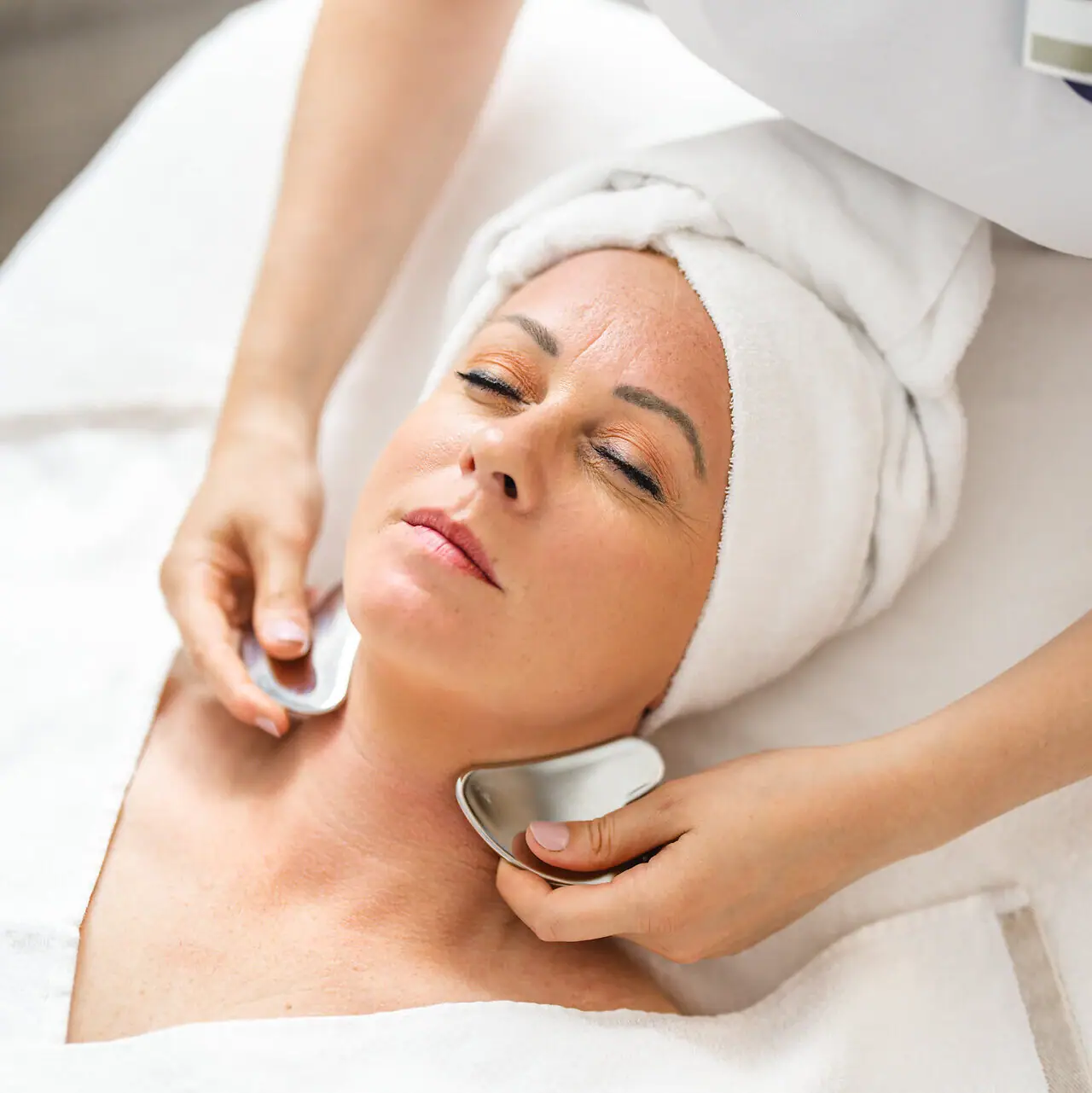 Facial application A woman receives a facial massage.