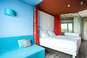 A room with a bed and a sofa.