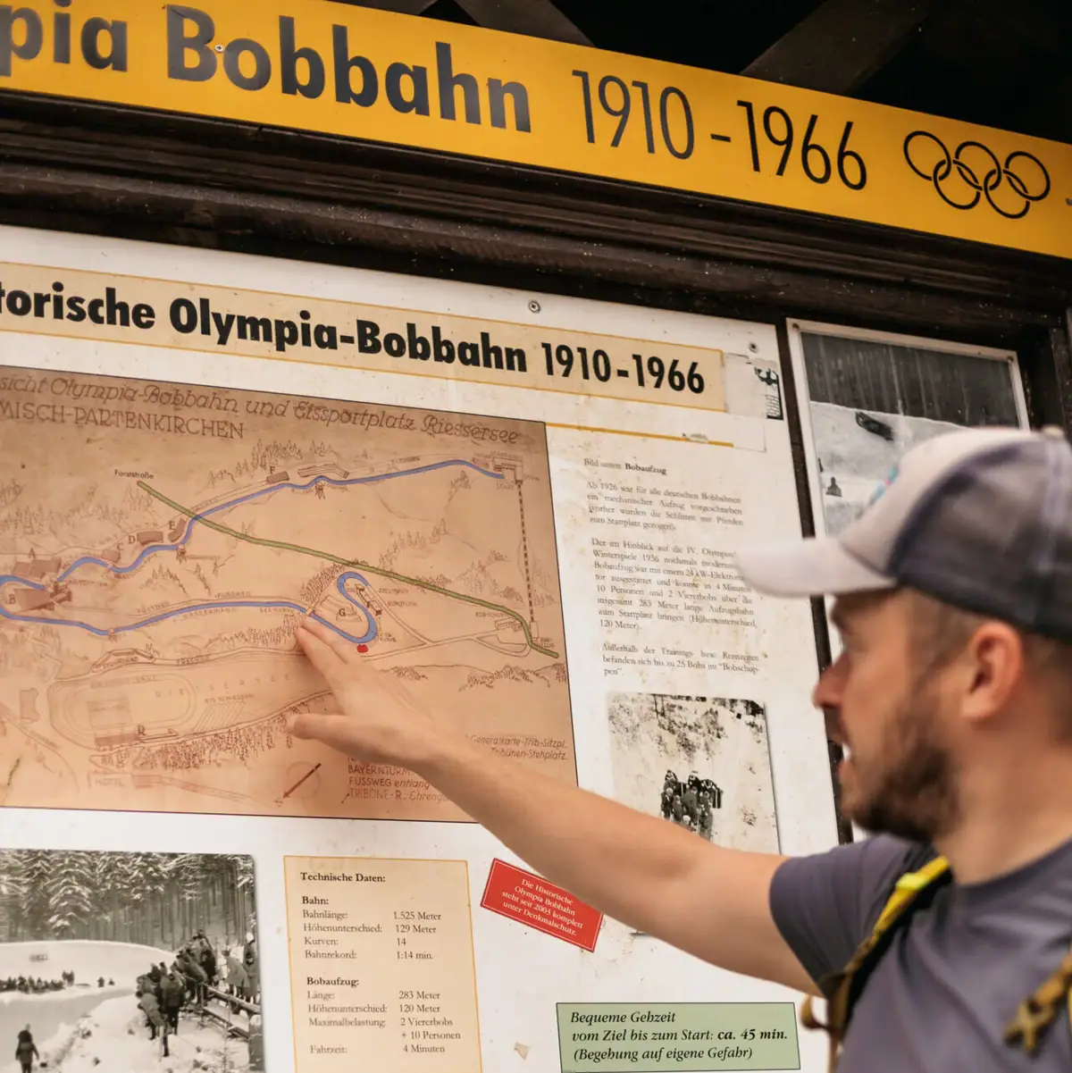 A man points to a map.
