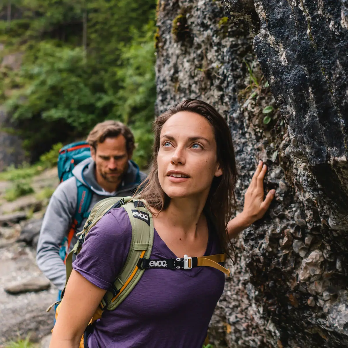Hiking A man and a woman hiking on a rock.