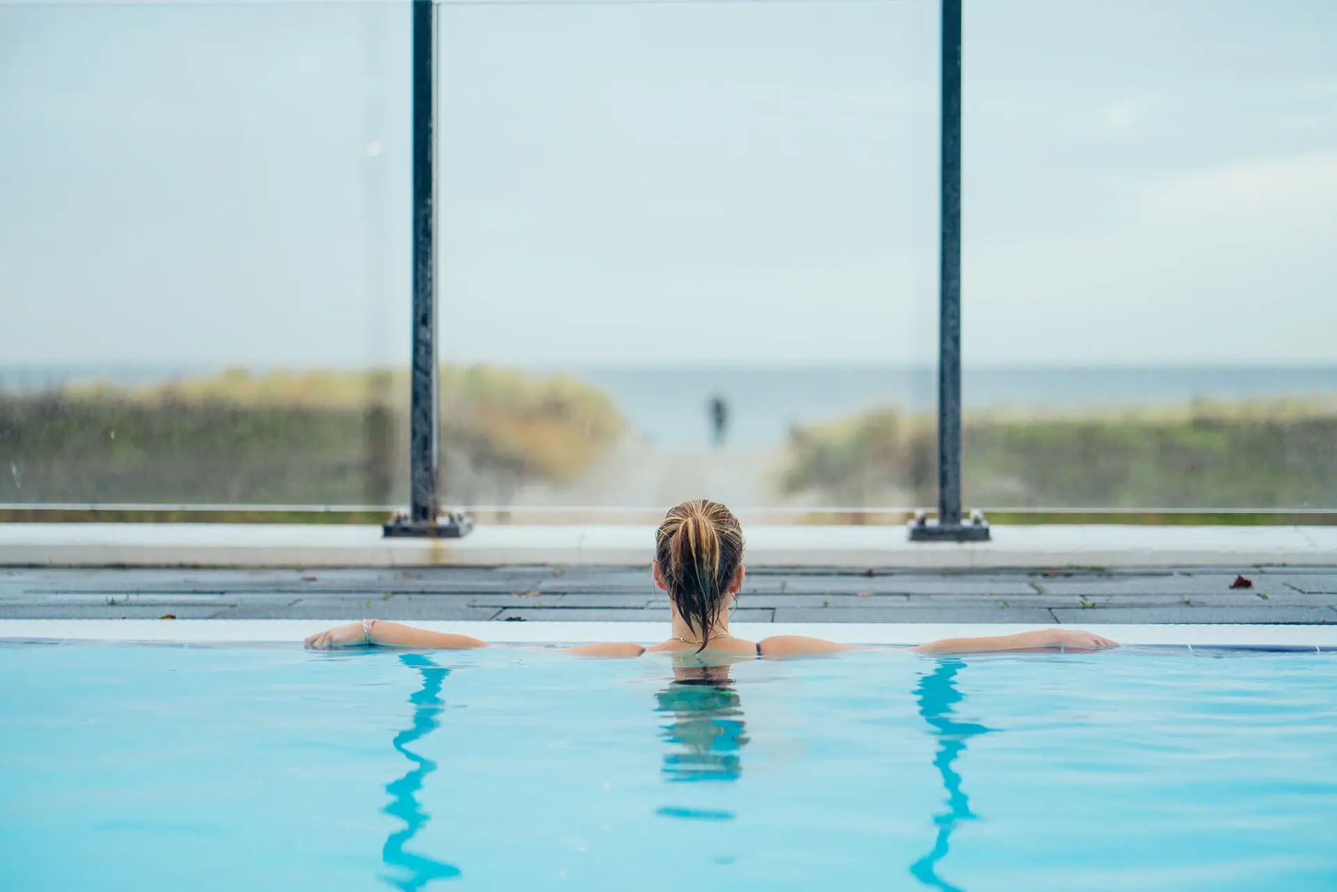A woman in a swimming pool.