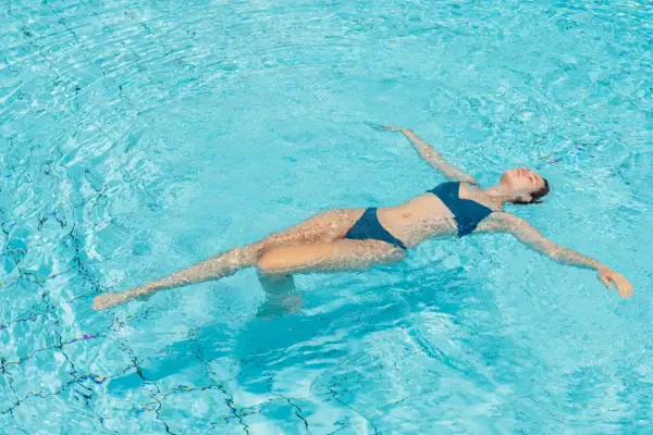 A woman in a swimming pool.