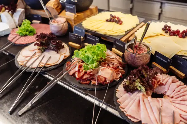 Buffet Buffet table displaying a variety of meats and delicacies.