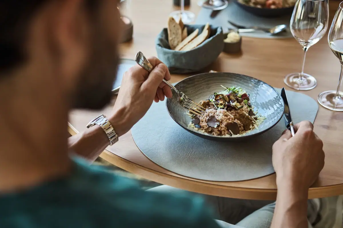 One person is eating at a table.