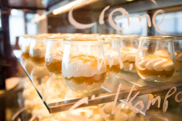 A group of dessert glasses.