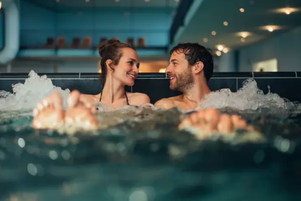 A man and a woman in a whirlpool.