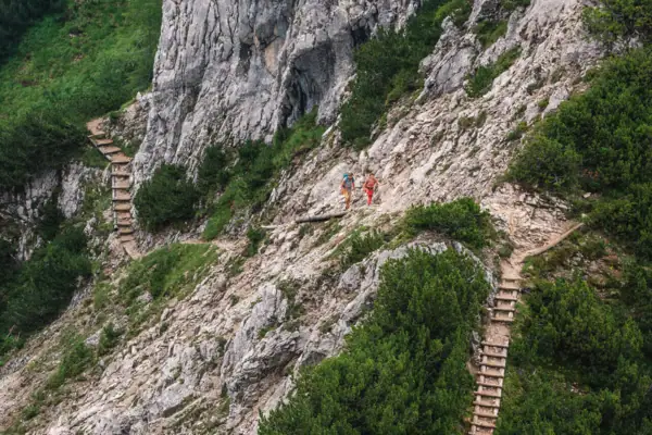 A group of people hiking on a rocky mountain.
