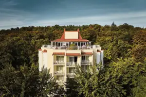 A building with trees in the background.