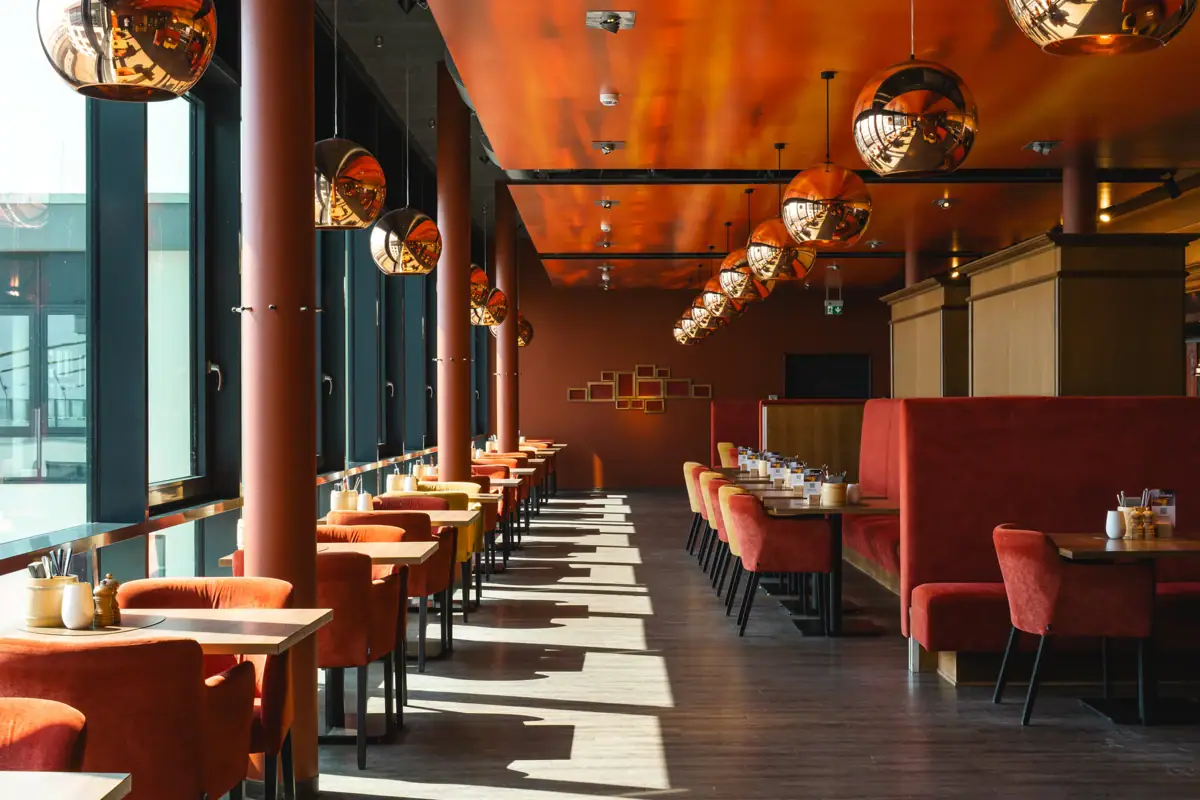 A room with tables and chairs.