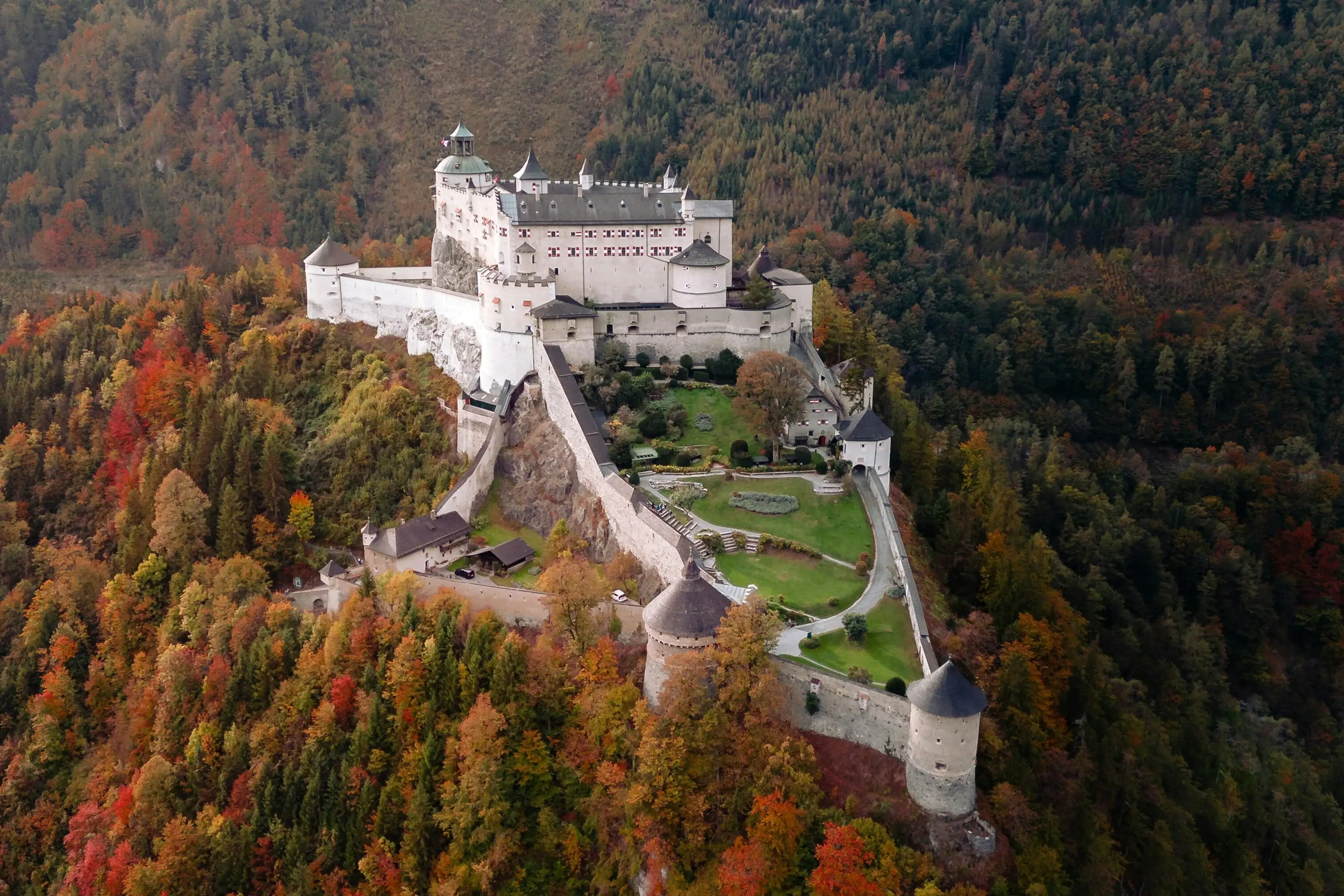 Castle on a hill with trees in autumn.