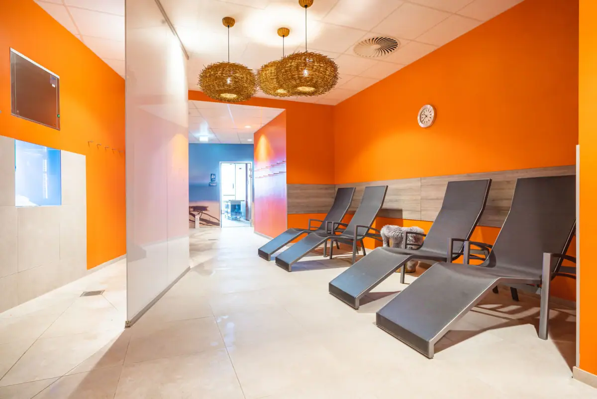 Chairs in a room with orange-coloured walls