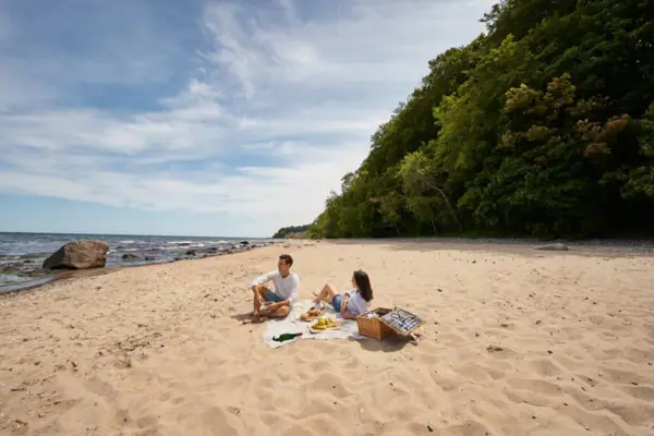 A man and a woman on the beach.