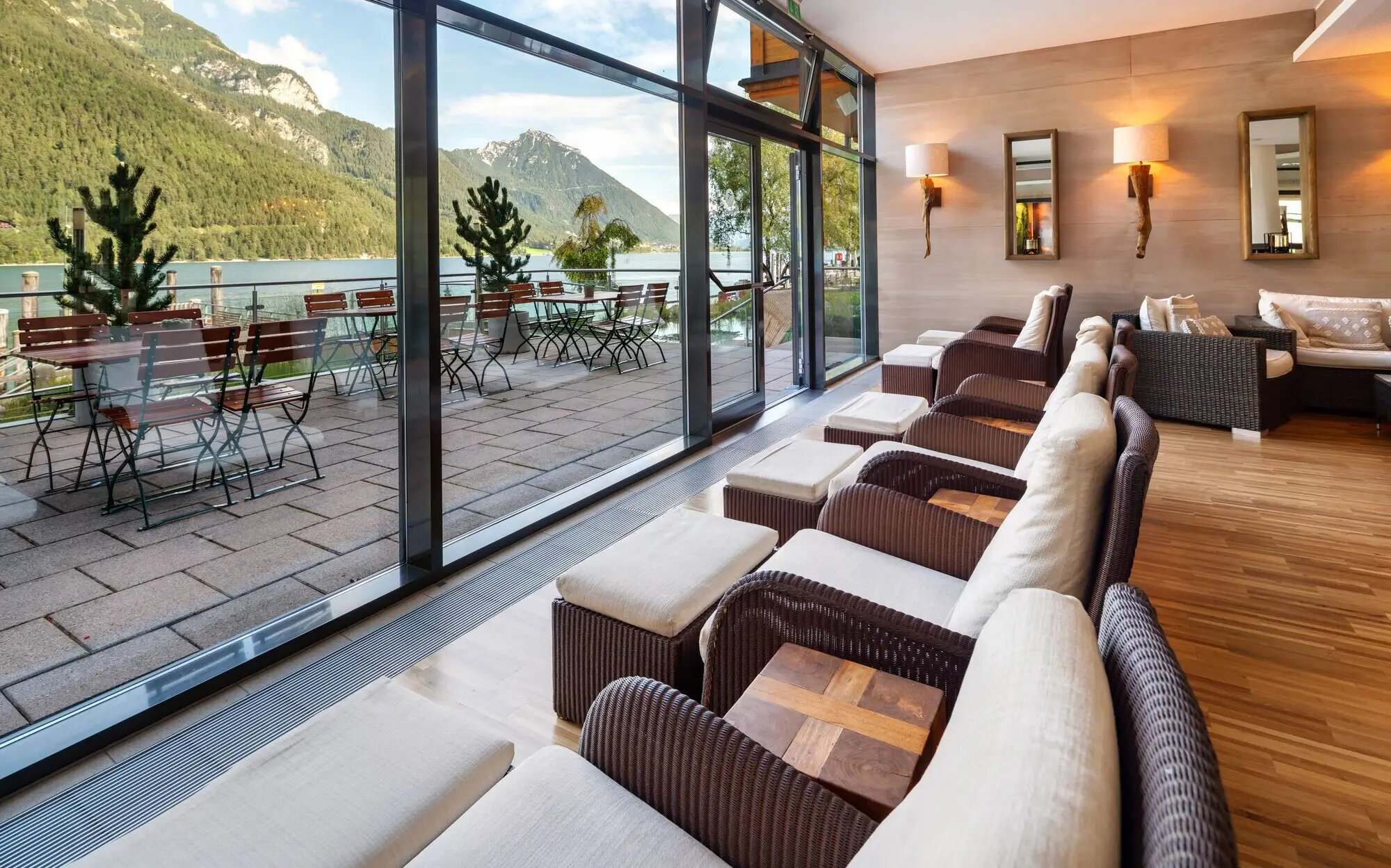 Interior with chairs and tables and mountain view.