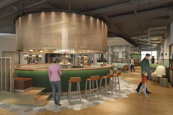 A large room with a bar and several people.