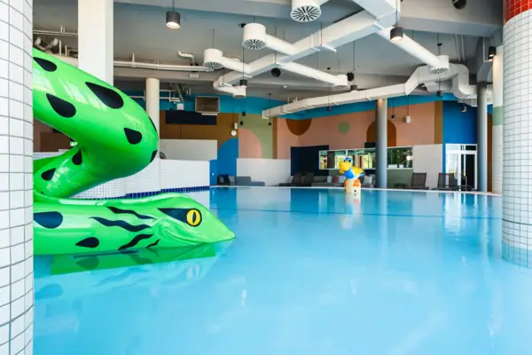 Children's area at aja Warnemünde Children's pool with a snake as a slide
