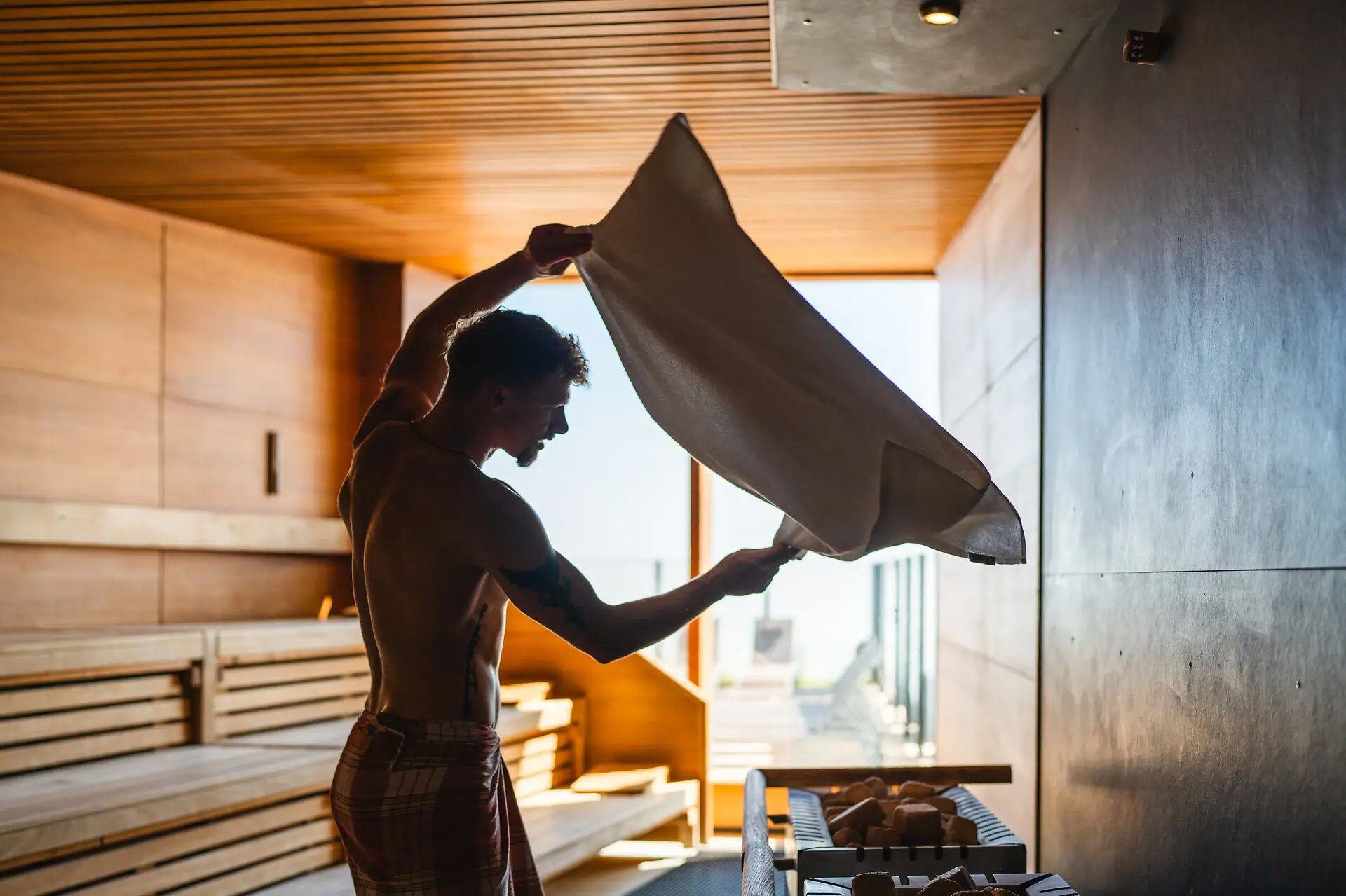 A man holds a towel.