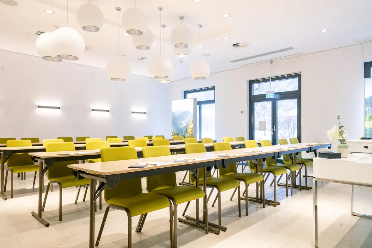 A room with tables and chairs.