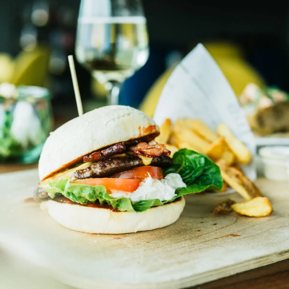 Burger Burgers and fries on a cutting board