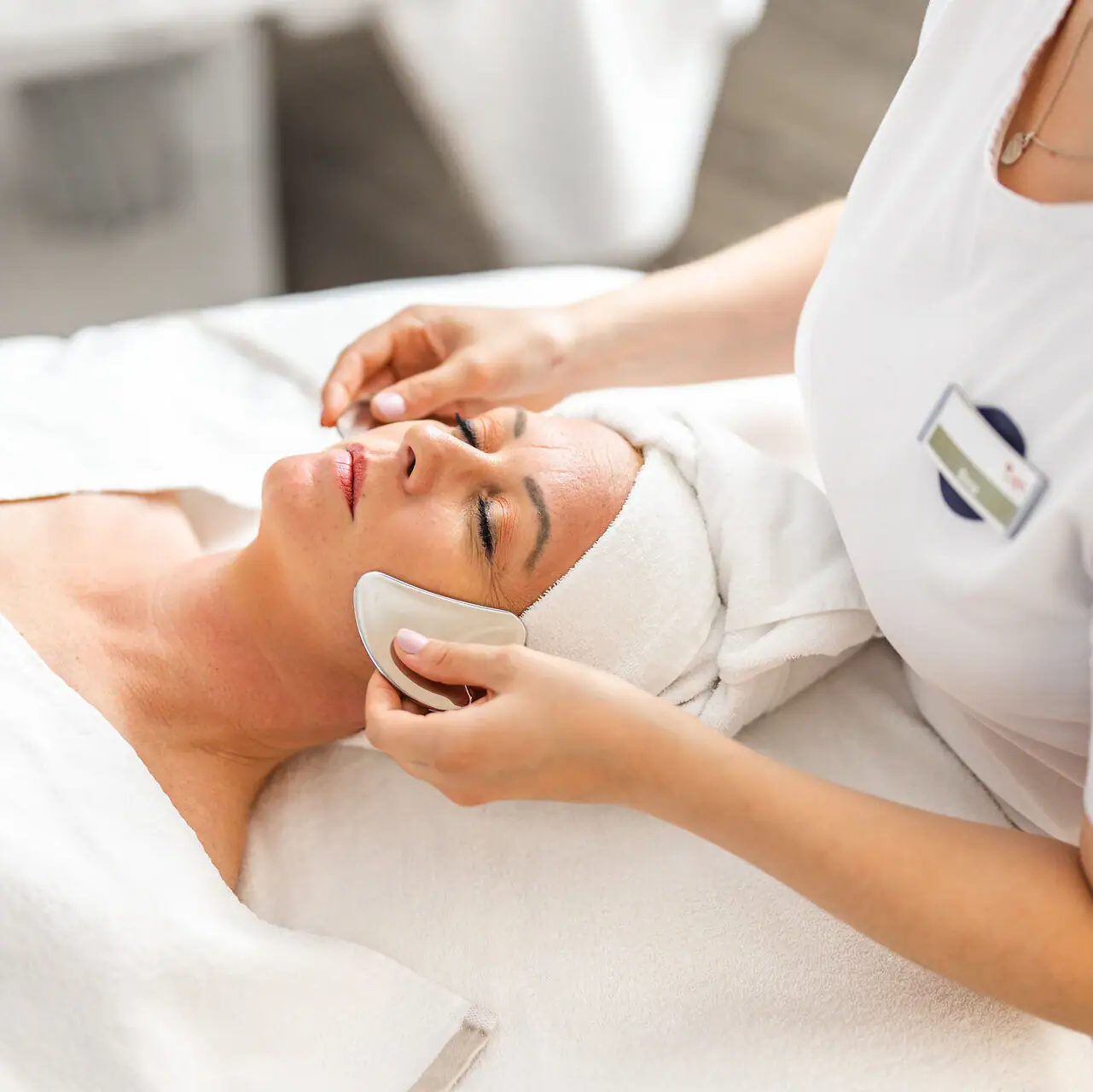 Facial application A woman receives a facial massage.
