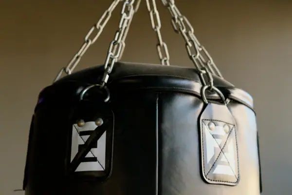 A punching bag hanging on a chain.