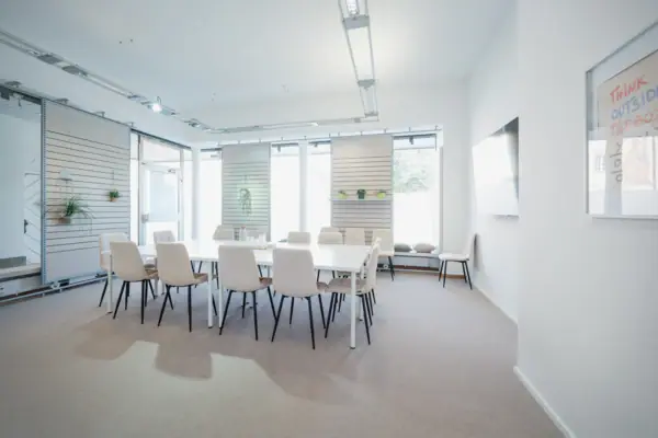 A room with a table and chairs.
