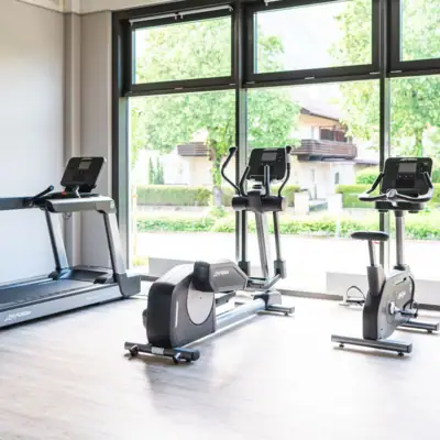 Fitness A room with fitness equipment and windows.