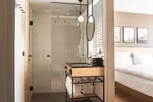 Family room A bathroom with a glass door in the shower.