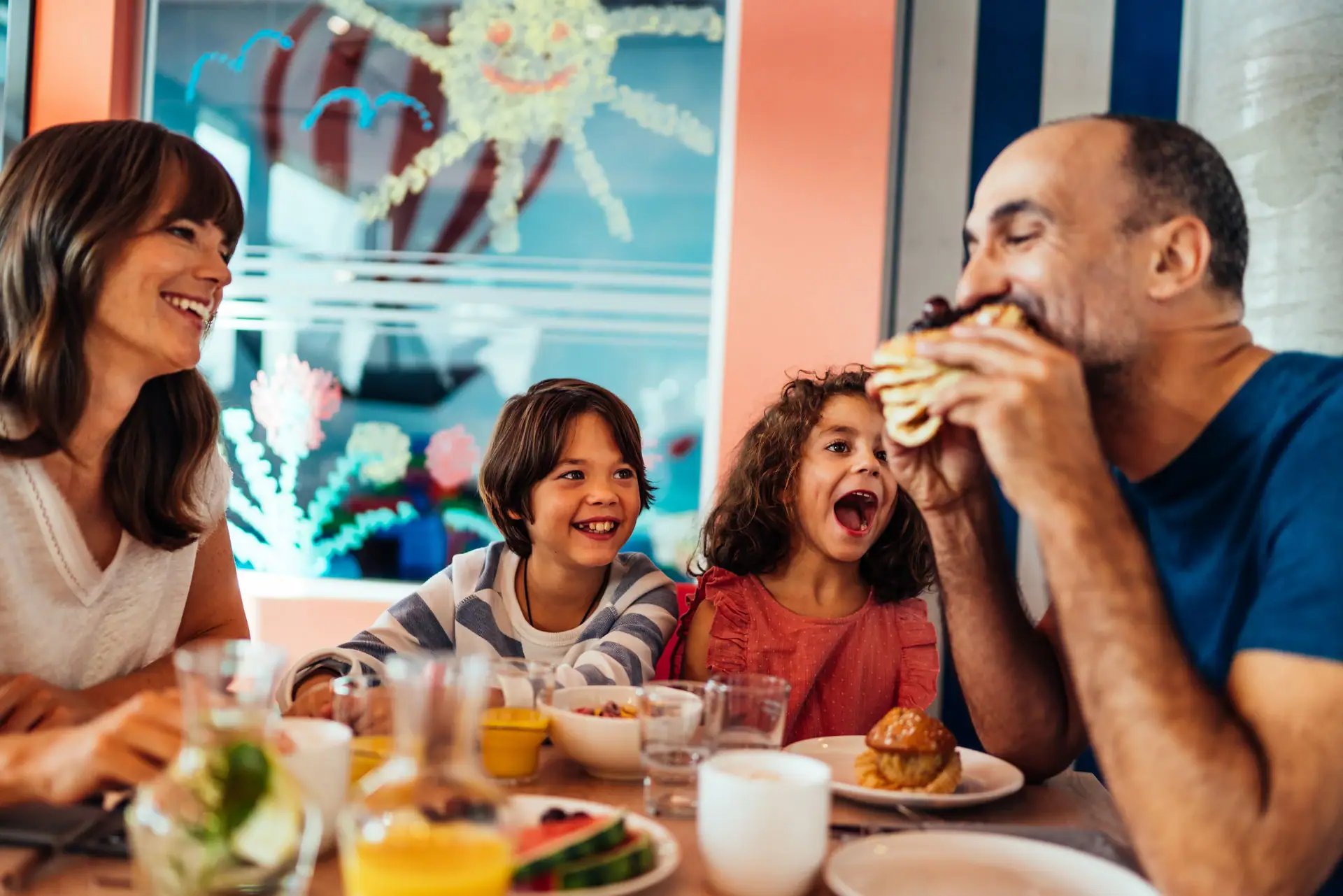 A group of people are eating at a table.