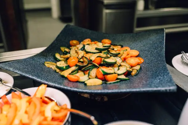 Vegetarian dishes A plate of vegetables on a table.