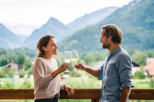 A man and a woman holding wine glasses.