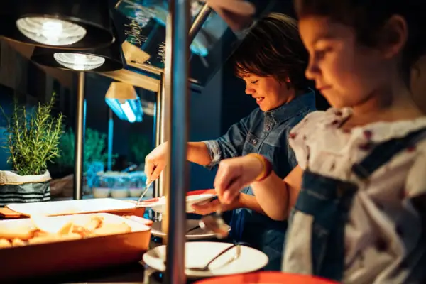 A group of children at the buffet.