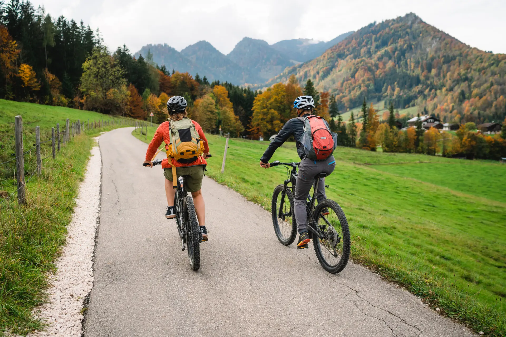 Mountain biking Two people are cycling on a road.