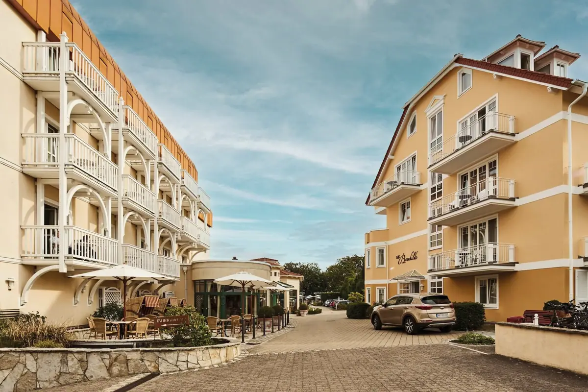 A street with buildings and cars in an urban setting