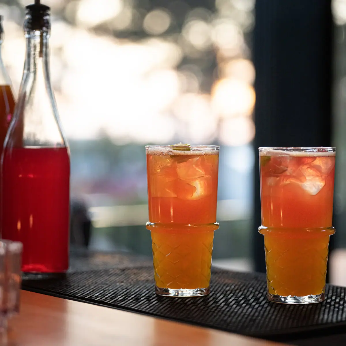 Bistro & Bar Two glasses with drinks on a table.