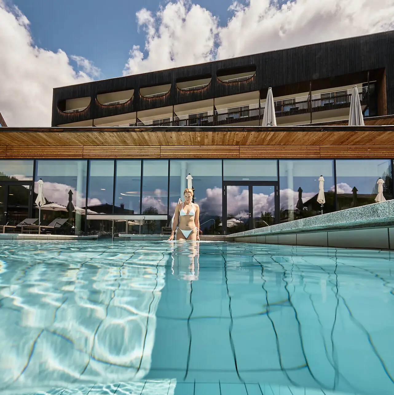 A woman in the hotel swimming pool